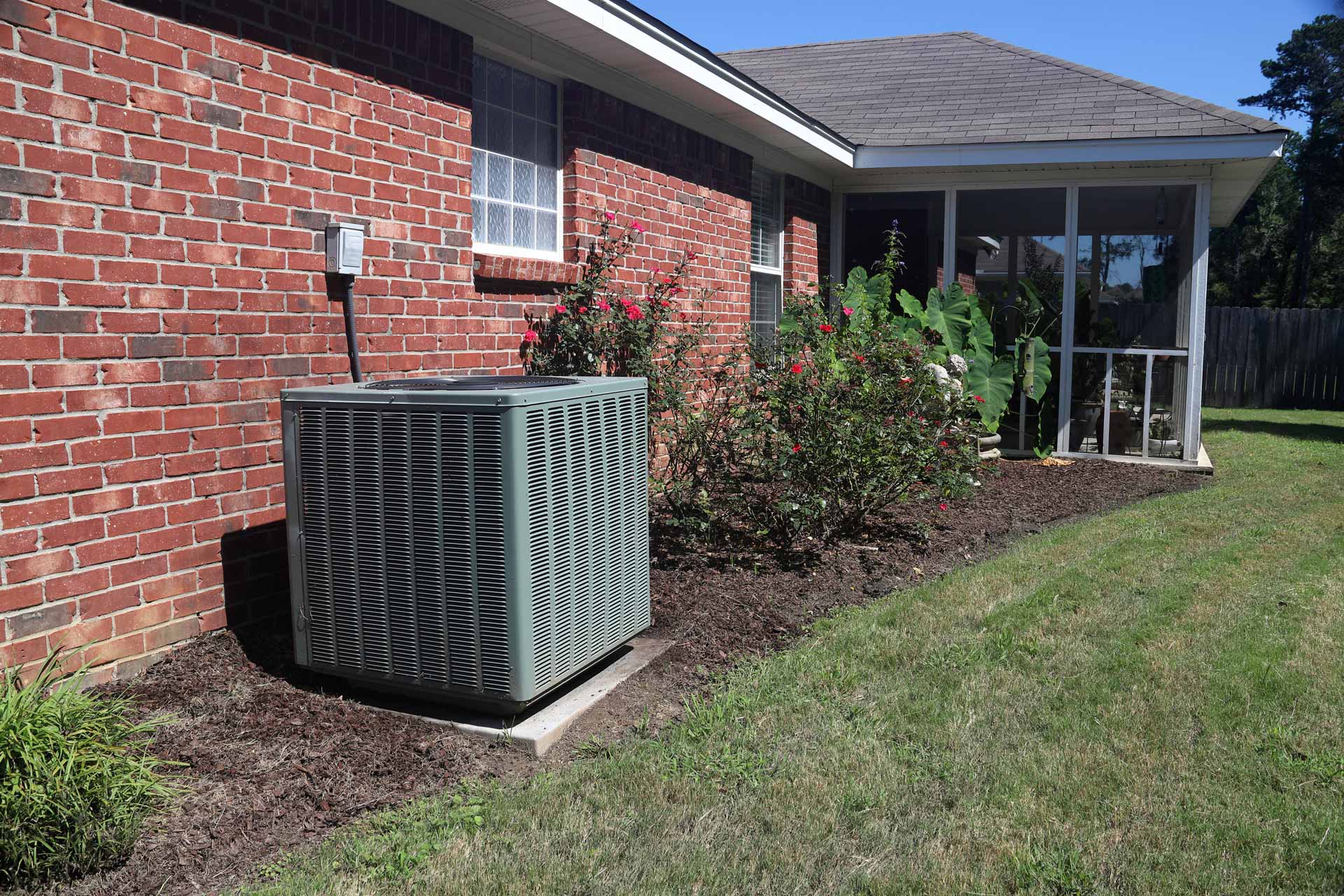 AC unit outside of a brick house