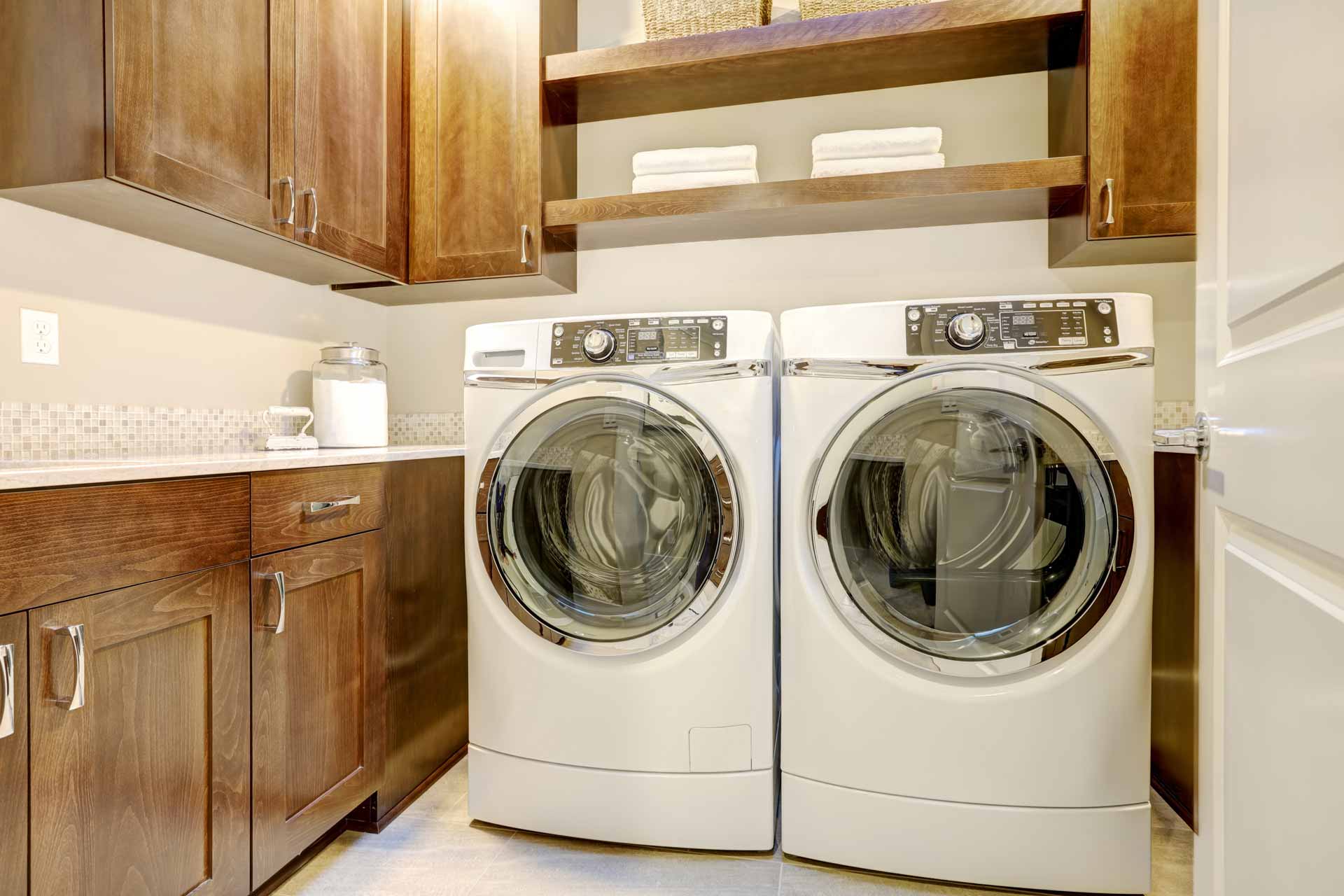 Washer and dryer in clean, organized laundry room