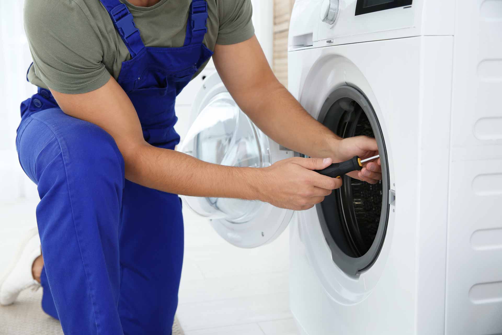 Technician fixing a dryer